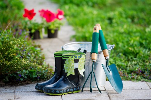 Operatives wearing PPE while working on a garden project