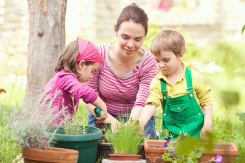 Gardeners separating green waste and recyclable materials